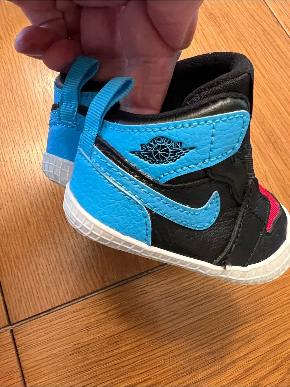 Nike Kids Black High-Top Sneakers with Blue and Red Accents